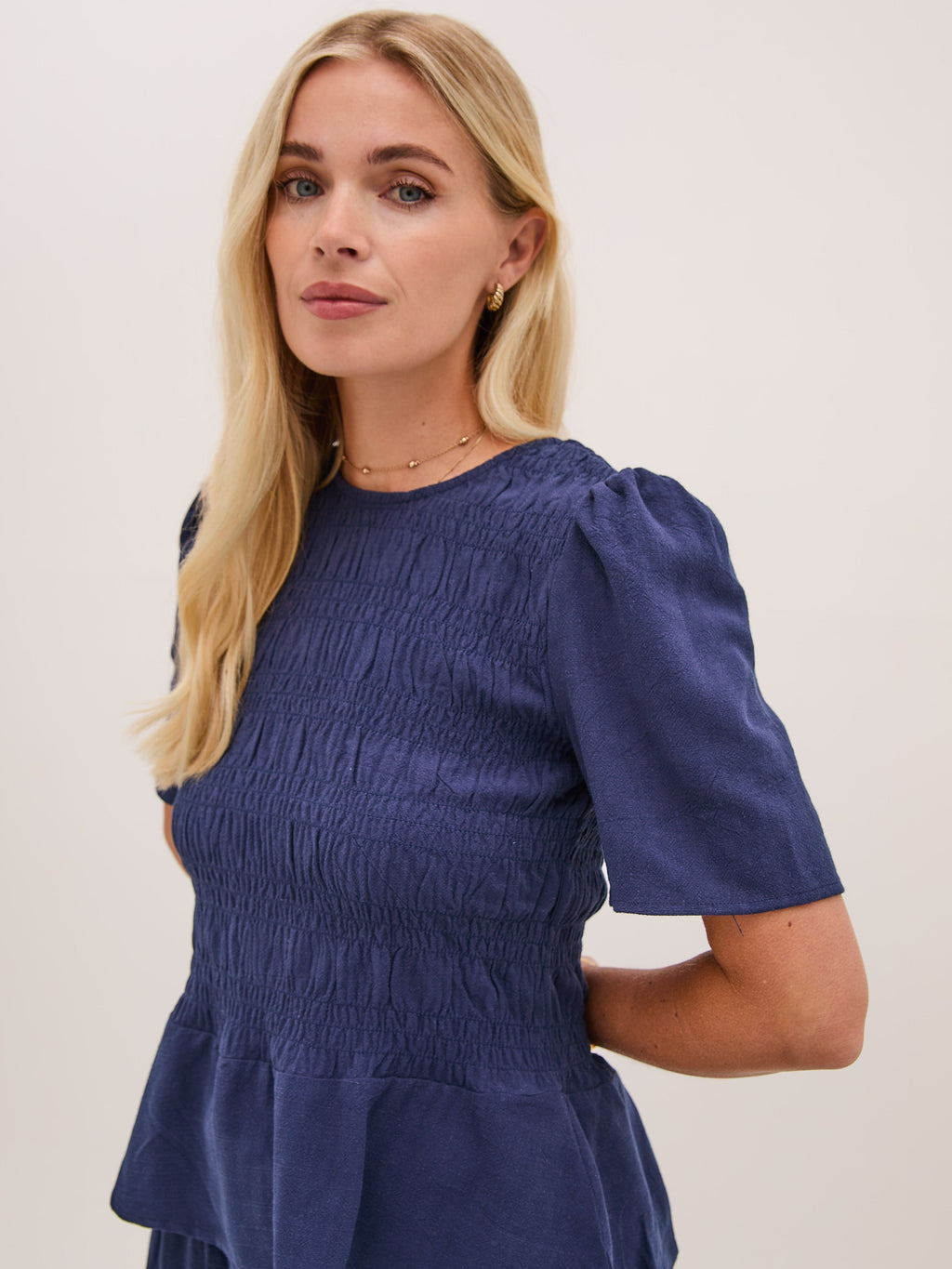 Marina Navy Peplum Top by Fika - Bare Fashion