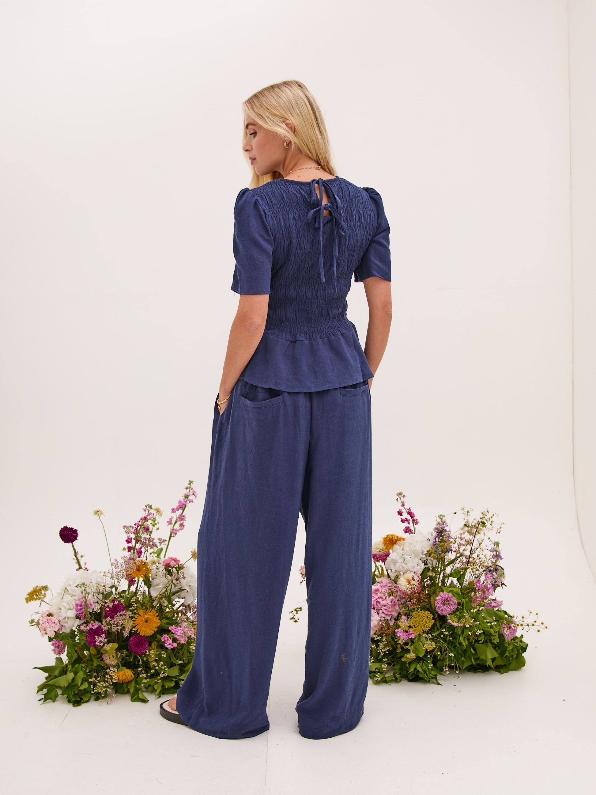 Marina Navy Peplum Top by Fika - Bare Fashion