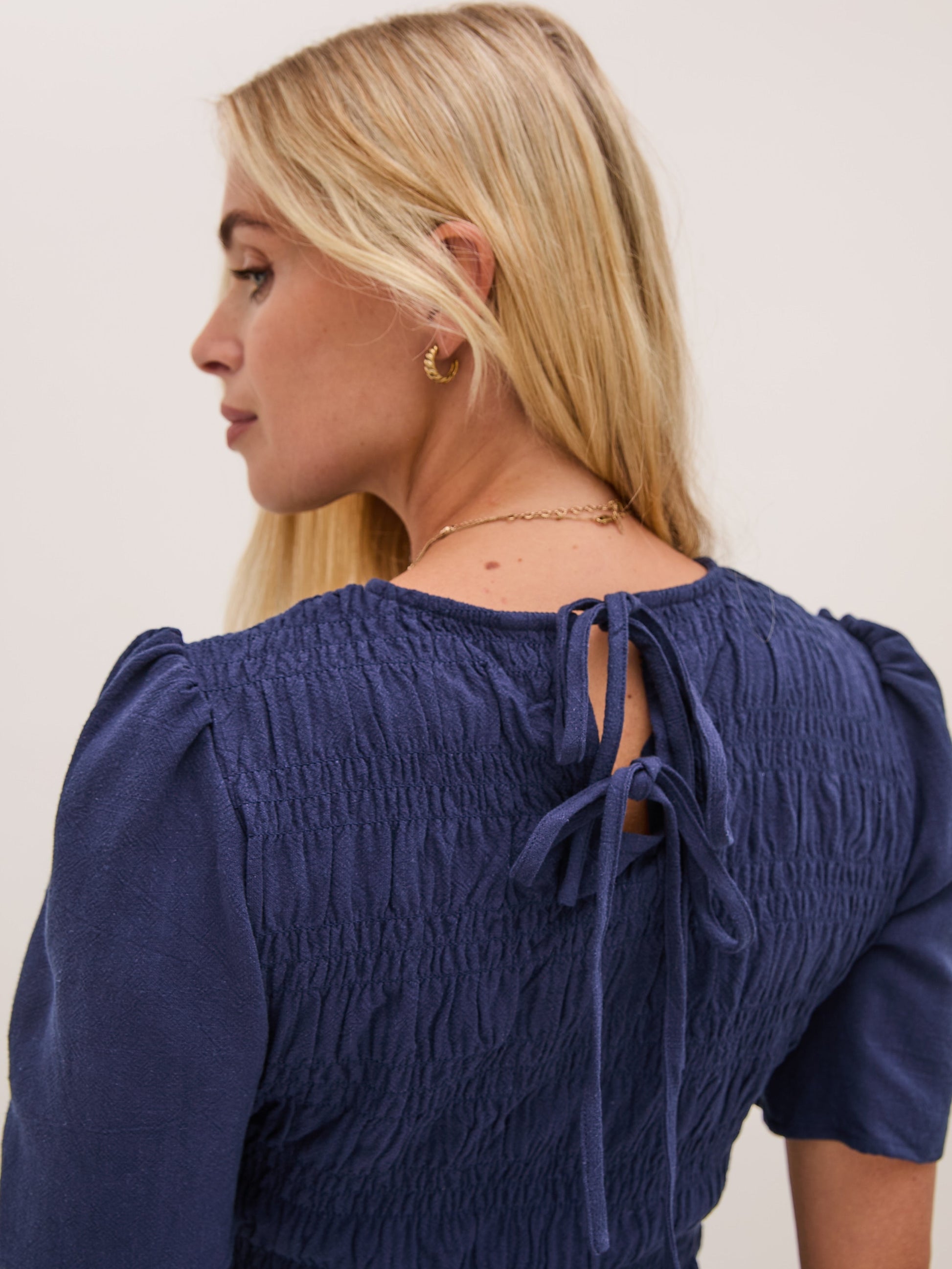 Marina Navy Peplum Top by Fika - Bare Fashion