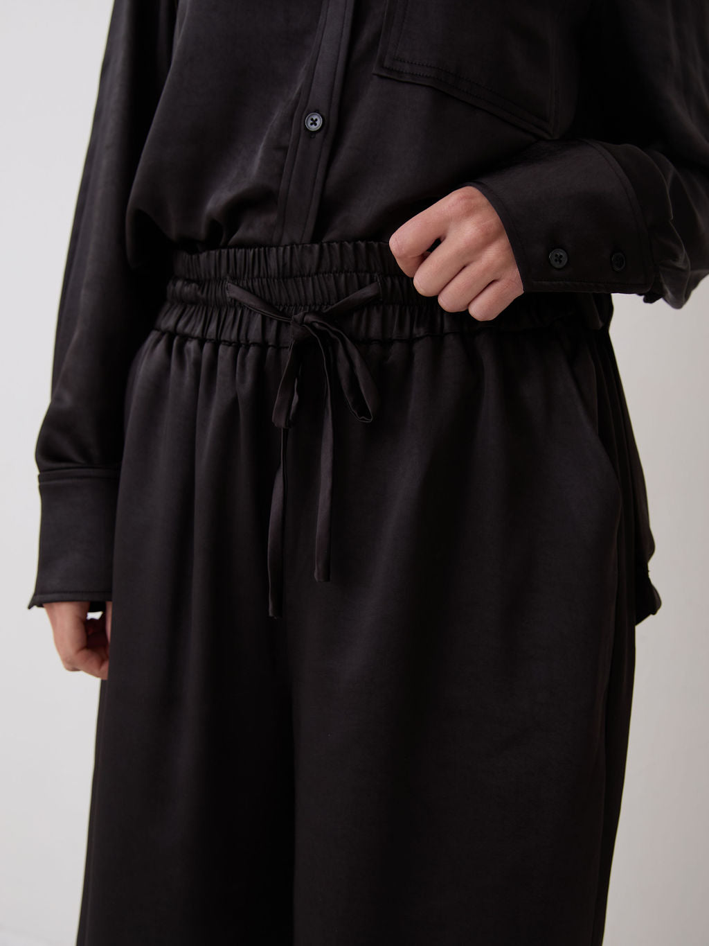 Ebba Black Satin Trousers by Fika - Bare Fashion