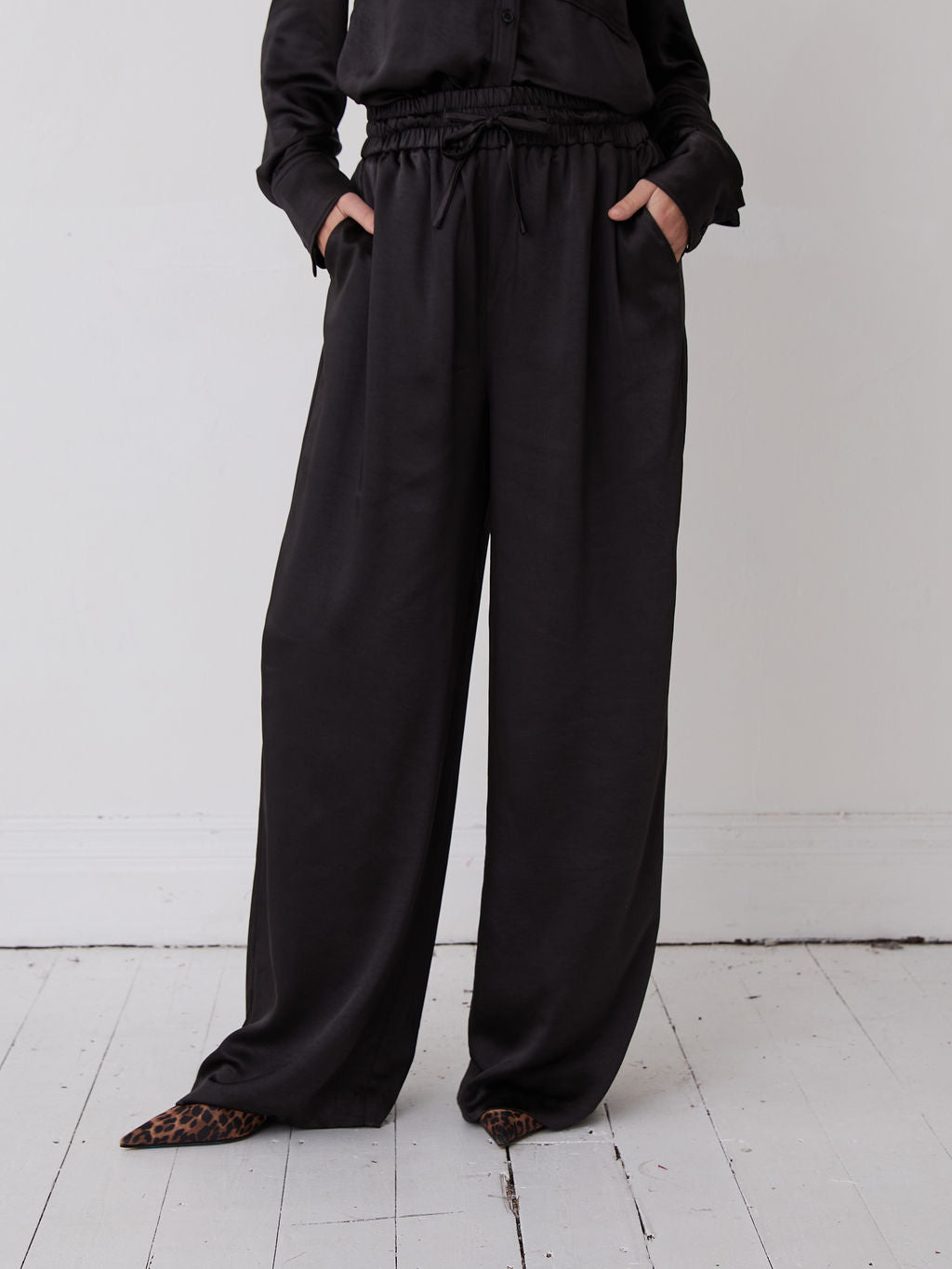 Ebba Black Satin Trousers by Fika - Bare Fashion
