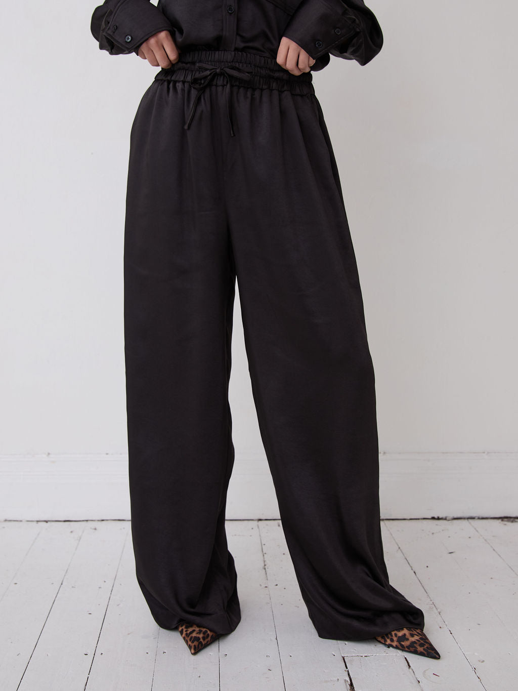 Ebba Black Satin Trousers by Fika - Bare Fashion